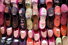 Colourful slippers on a rack for sale Fes Morocco